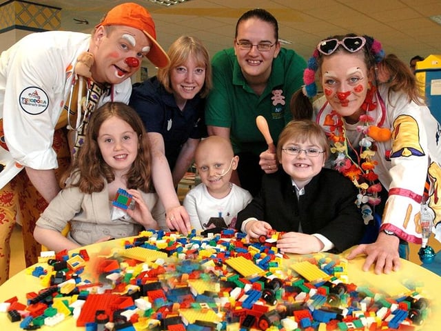 Day care patients at Sheffield's Children's Hospital pictured at the opening of the new Children's Hospital Day Care Centre with clown doctors "Willie Pop" and "Ding Dong", ward manager, Jackie Sanderson, and play specialist, Lisa Bloxholme, on April 18, 2006