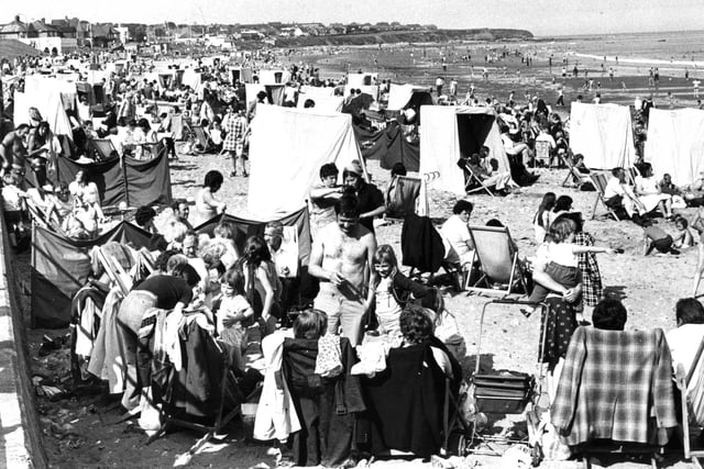Lots of people on the beach in this Seaburn scene from August 1978, including some who hired a windbreak or a shelter.