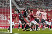 Kean Bryan of Sheffield Utd scoring his side's opening goal during the Premier League match at Old Trafford, Manchester: Andrew Yates/Sportimage