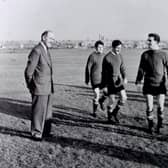The late Manchester United and England footballer David Pegg (fourth left) looks towards Matt Busby (left), later Sir Matt Busby, with fellow players, from left, Wilf McGuiness, Dennis Violet and Tommy Taylor also pictured.