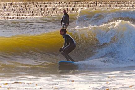 Two surfers on the water.