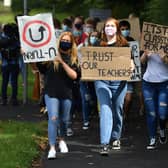 Students march to the constituency office of their local MP Gavin Williamson, who is also the Education Secretary, as a protest over the continuing issues of last week's A-level results which saw some candidates receive lower-than-expected grades after their exams were cancelled as a result of coronavirus.