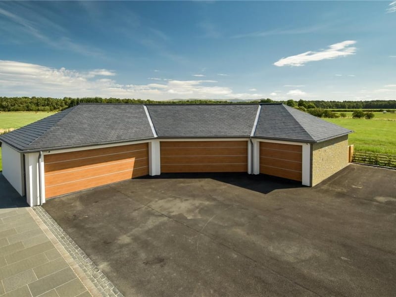 Triple garage and store room.