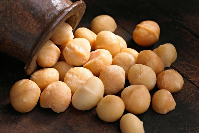 Macadamia nuts contain a toxin that can affect a dog’s muscles and nervous system. Within 12 hours of ingestion, macadamia nuts can cause dogs to experience weakness, depression, tremors, vomiting and increased body temperature.