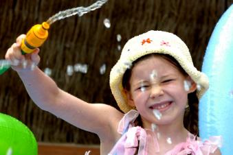 Ellie Cooper aged 6 in 2006 enjoying her paddling pool.