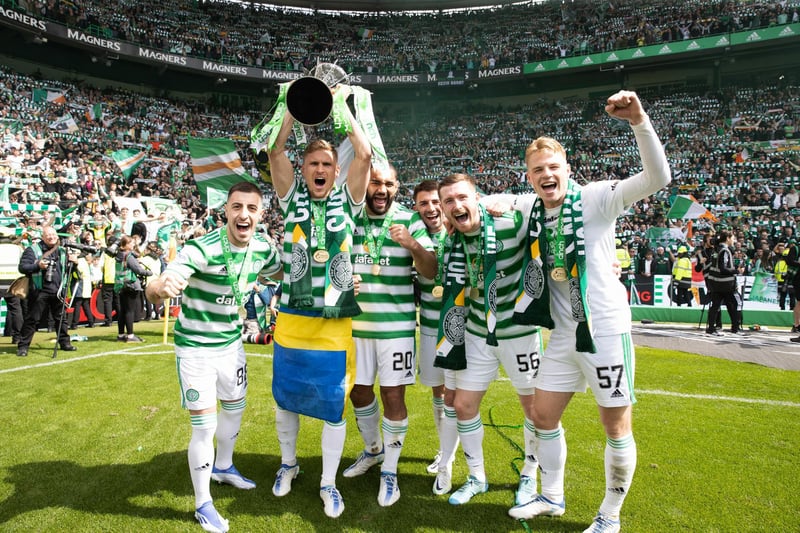 Juranovic pictured with his Celtic team-mates as Carl Starfelt holds the Premiership trophy aloft on the final day of the season in May 2022.