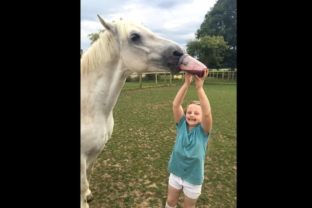 Catriona Cleugh 7 year old daughter sharing her smoothie with my horse Hugo at Hambledon. I think he's enjoying it! It was judged 3rd Place.