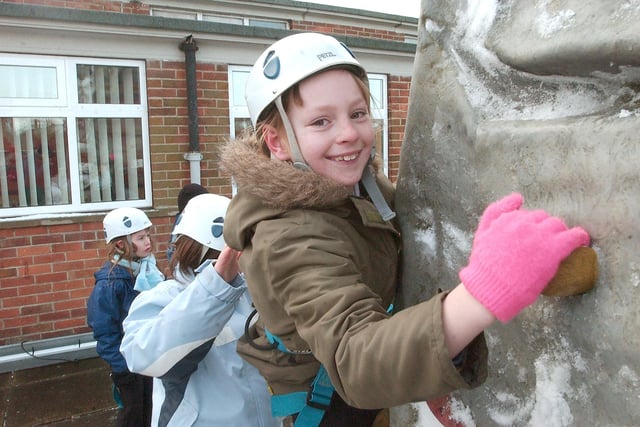 Golden Flatts Primary pupil Caitlin Joyce scales the West View Project climbing wall during the cold snap of 2013.