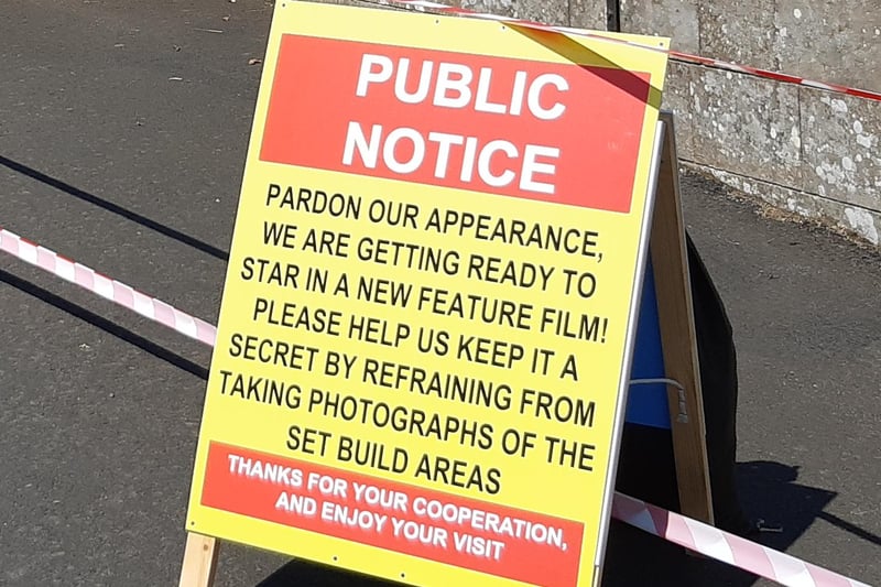 A sign asking visitors not to take photographs of the set.