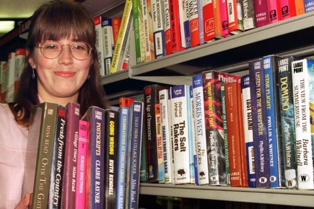 Helen Charlton a library assistant at the Doncaster Central Library in 1996. Standing in the Large Print section.