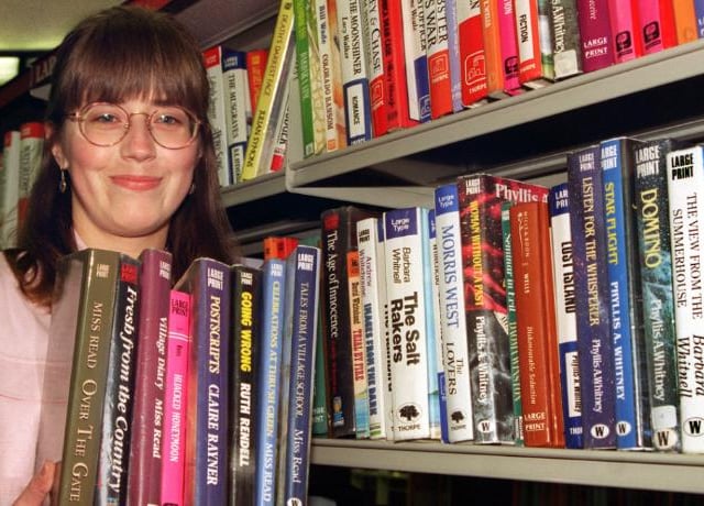 Helen Charlton a library assistant at the Doncaster Central Library in 1996. Standing in the Large Print section.