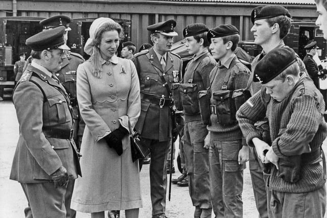 Last minute adjustments by one harassed cadet as Princess Anne inspects her troops at the Manor TA Centre, Sheffield, 19th July 1980