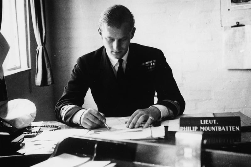 Lieutenant Philip Mountbatten, prior to his marriage to Princess Elizabeth, pictured working at his desk after returning to his Royal Navy duties at the Petty Officers Training Centre in Corsham, in 1947. (Photo: Douglas Miller/Keystone/Getty Images)