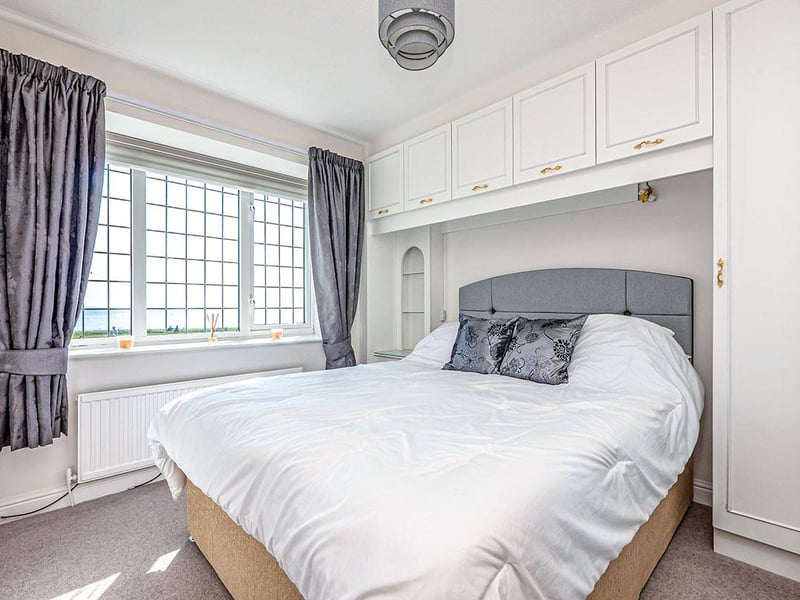 Another front-facing, double bedroom, with built-in wardrobes.