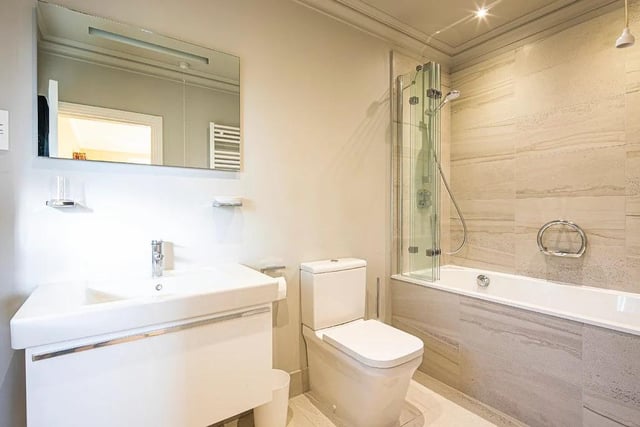 The house has two bathrooms, where tiling frames the Villeroy & Boch suites.