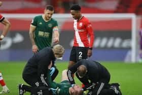 Oli McBurnie receives treatment on the pitch at Southampton: David Klein/Sportimage