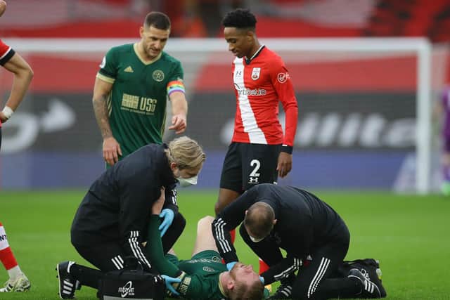 Oli McBurnie receives treatment on the pitch at Southampton: David Klein/Sportimage