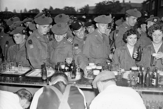 Soldiers from the 1st Battalion Royal Scots visit Murray's Breweries, in Craigmillar, after a 140 mile march in June 1960.