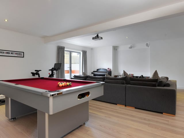 The games/ cinema room has plenty of room.