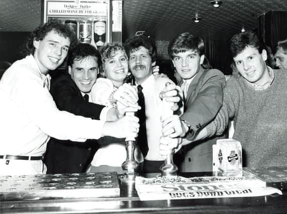 Pulling the first pints at the official re-opening of the Arbourthorne Hotel by Sheffield Wednesday and United players - left to right, Mel Sterland, Gary Shelton (SW), Josie and Terry Fisher (landlady and landlord), Charlie Williamson (SW) and Russell Black (SU), 1984