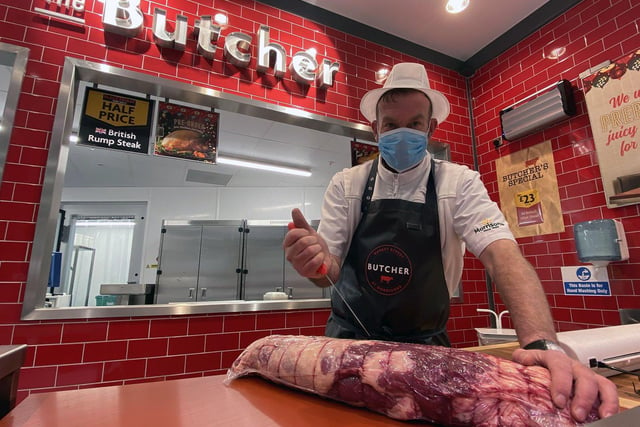 Michael Smith is among the staff working at the store's butcher counter.
