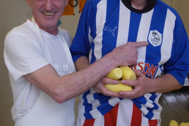Kevin Palmer lost a bet against chip shop owner Rob Pearce of Rob's Fish and Chips in Greenhill in 2013 and had to wear a Sheffield Wednesday shirt while peeling potatoes at Rob's shop