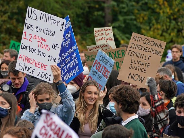 Some of the many placards at Kelvingrove Park, ahead of the Fridays for Future Scotland march through Glasgow