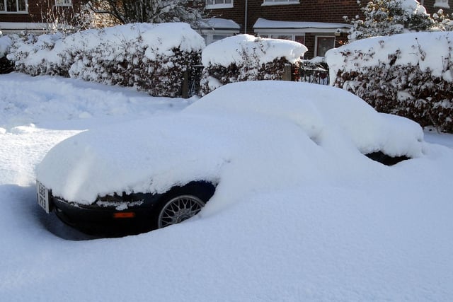 A car all but disappeared in snow on Penine Close, Huthwaite in December 2010