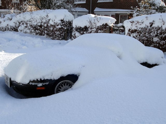 A car all but disappeared in snow on Penine Close, Huthwaite in December 2010