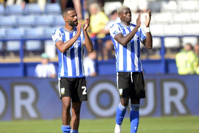 Sheffield Wednesday pair Michael Ihiekwe and Dominic Iorfa applaud supporters at the final whistle of their 5-0 win over Forest Green Rovers.