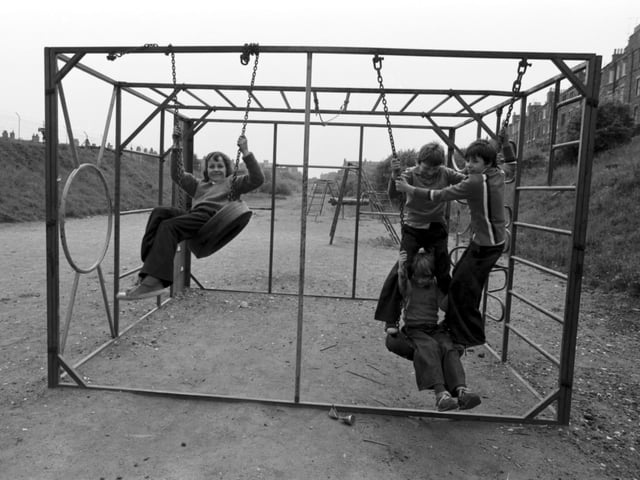 Children in an adventure playground where the tyre swings were always popular.