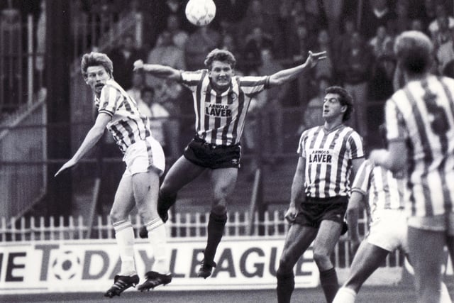 United's Steve Foley gets above the Huddersfield defence in October 1986.