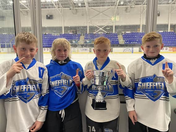 Some of the Sheffield Ice Hockey Academy u12s players with their National Finals trophy
