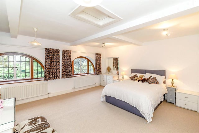 There are four bedrooms in total, including this large master room which boasts patio doors that lead out onto a private roof terrace.