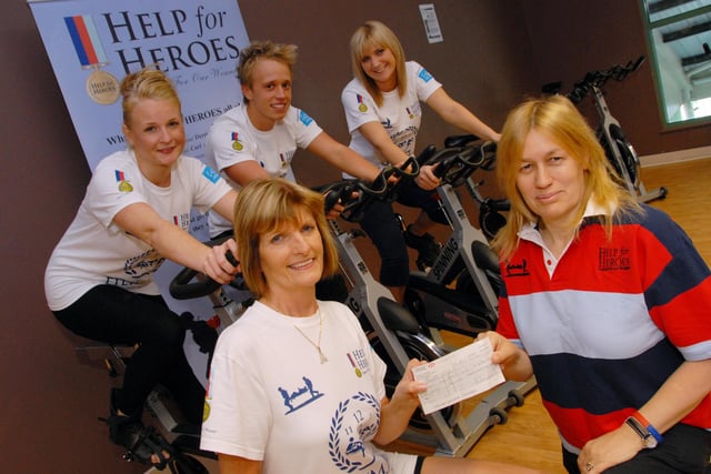 Mansfield's Oasis Health Club hosted a Gym For Heroes, 12 hour spin-a-thon organised by Anne Whitehouse in memory of Adrian Sheldon who died while serving in Afghanistan. Anne, front left, is pictured  in 2011 presenting £657.34 raised from the event to Jane Harris, front right, a volunteer co-ordinator for Help For Heroes watched from the left by; Leanne Crouch, Carl Fairbrother and Instructor Samantha Lafferty who all took part.