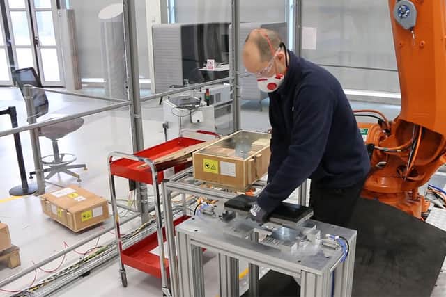 2021 - AMRC engineer, Dr Alexei Winter, demonstrates the automation process for positioning powerful magnets for Sheffield-based Magnomatics. The AMRC made the labour-intensive process 60 times faster.