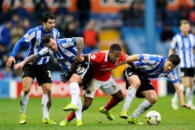 The Sheffield Wednesday trio of Alex Lopez, Ross Wallace and Fernando Forestieri get to grips with Charlton Athletic's Callum Harriott. Picture: Steve Ellis