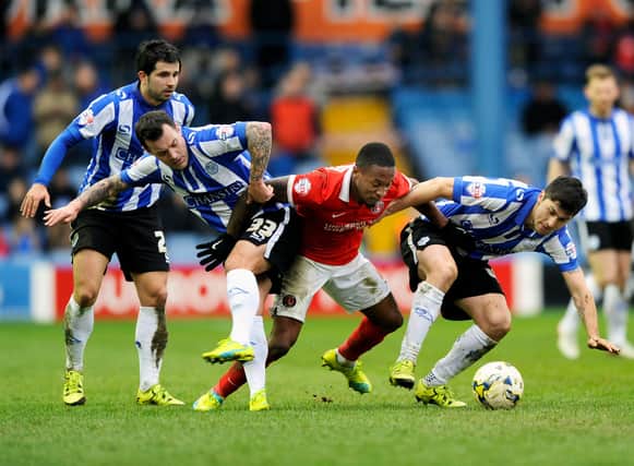 The Sheffield Wednesday trio of Alex Lopez, Ross Wallace and Fernando Forestieri get to grips with Charlton Athletic's Callum Harriott. Picture: Steve Ellis