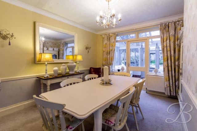 The pleasant dining room is part of the open-plan living area at the Caudwell Drive property. It also has access to the conservatory.