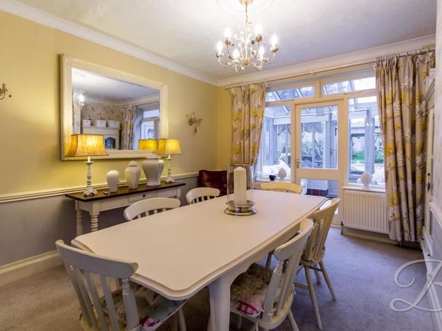 The pleasant dining room is part of the open-plan living area at the Caudwell Drive property. It also has access to the conservatory.