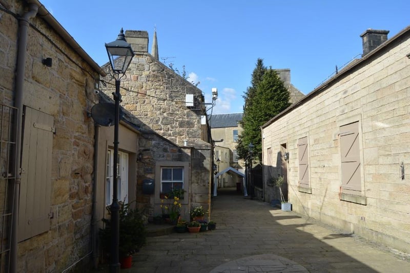 The cottage is set within a period courtyard.