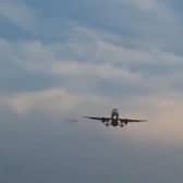 The mystery object can be seen flying past the plane at high speed.
