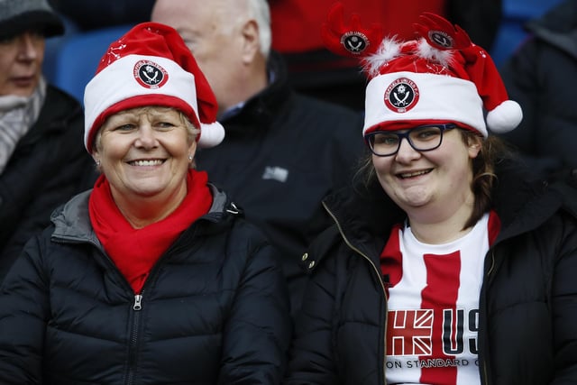 Blades fans don their Santa hats at Brighton & Hove Albion's Amex Stadium in December 2019.