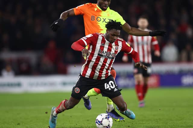 Keinan Davis of Nottingham Forest fouls Femi Seriki of Sheffield United during the Sky Bet Championship match at Bramall Lane, Sheffield. Picture credit should read: Darren Staples / Sportimage