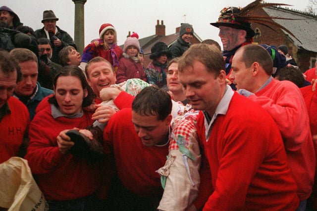 The Haxey Hood took place at the Isle Village in 1999 The Hood Fool, Dale Smith is carried infront of the church to address the people and commence the game