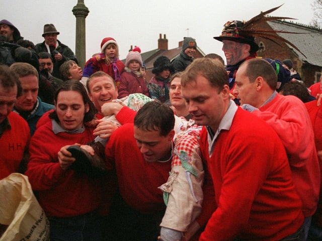 The Haxey Hood took place at the Isle Village in 1999 The Hood Fool, Dale Smith is carried infront of the church to address the people and commence the game