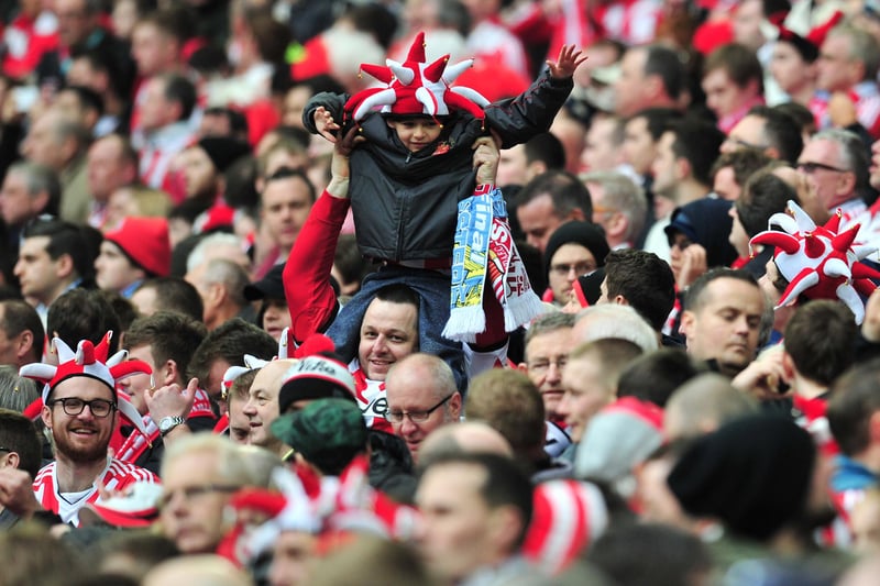 Sunderland fans watch the League Cup final football match between Manchester City and Sunderland at Wembley Stadium.