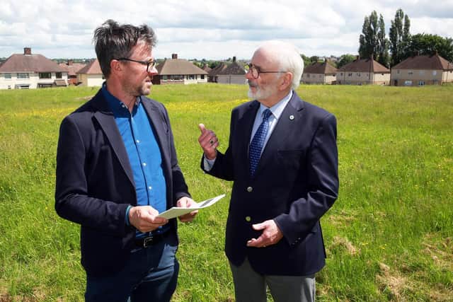 Steve Birch from Sheffield Housing Company and Cllr Tony Damms discuss the forthcoming Malthouses project as well as the information leaflets that will be given to local residents, Sheffield, United Kingdom, 11th June 2021. Photo by Glenn Ashley.