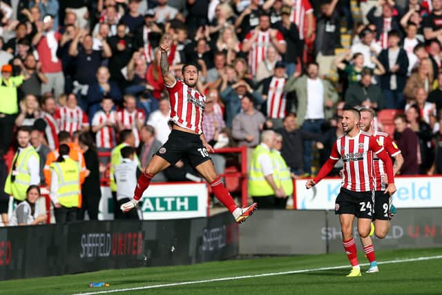 Billy Sharp celebrates scoring the winner against Derby County after fans of both teams had paid their respects to Stephen Clifton with a round of applause earlier in the match at Bramall Lane (pic: Barrington Coombs/PA Wire)