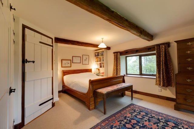 The spacious double master bedroom has side and rear facing timber double glazed windows and a range of fitted furniture to one wall.